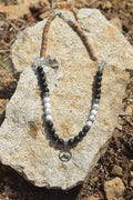 Collier d’intention - Cap sauvage (Onyx noir mat, howlite mate, cristal de roche et jaspe paysage)
